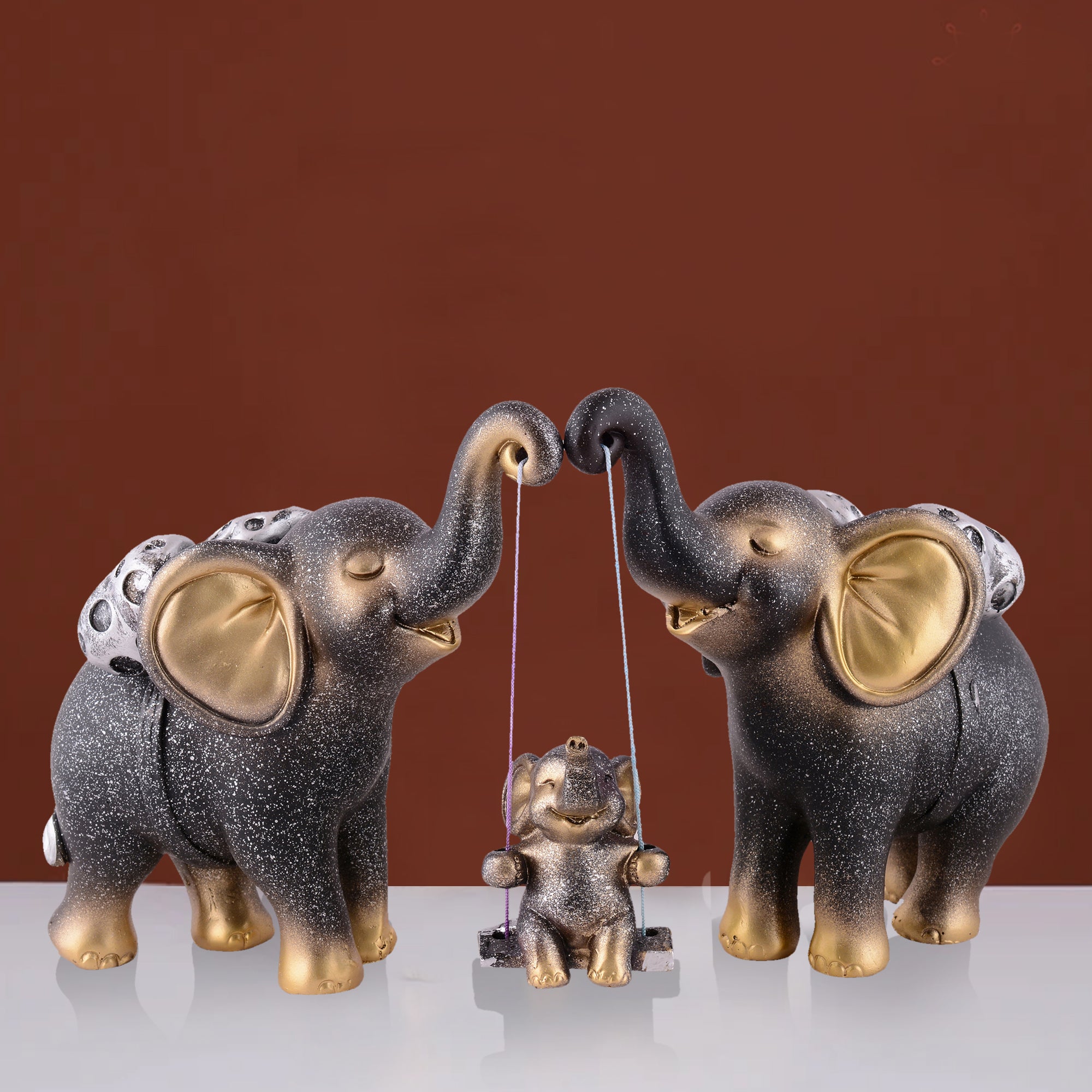 Elephant Family Showpiece with Baby on Swing - White