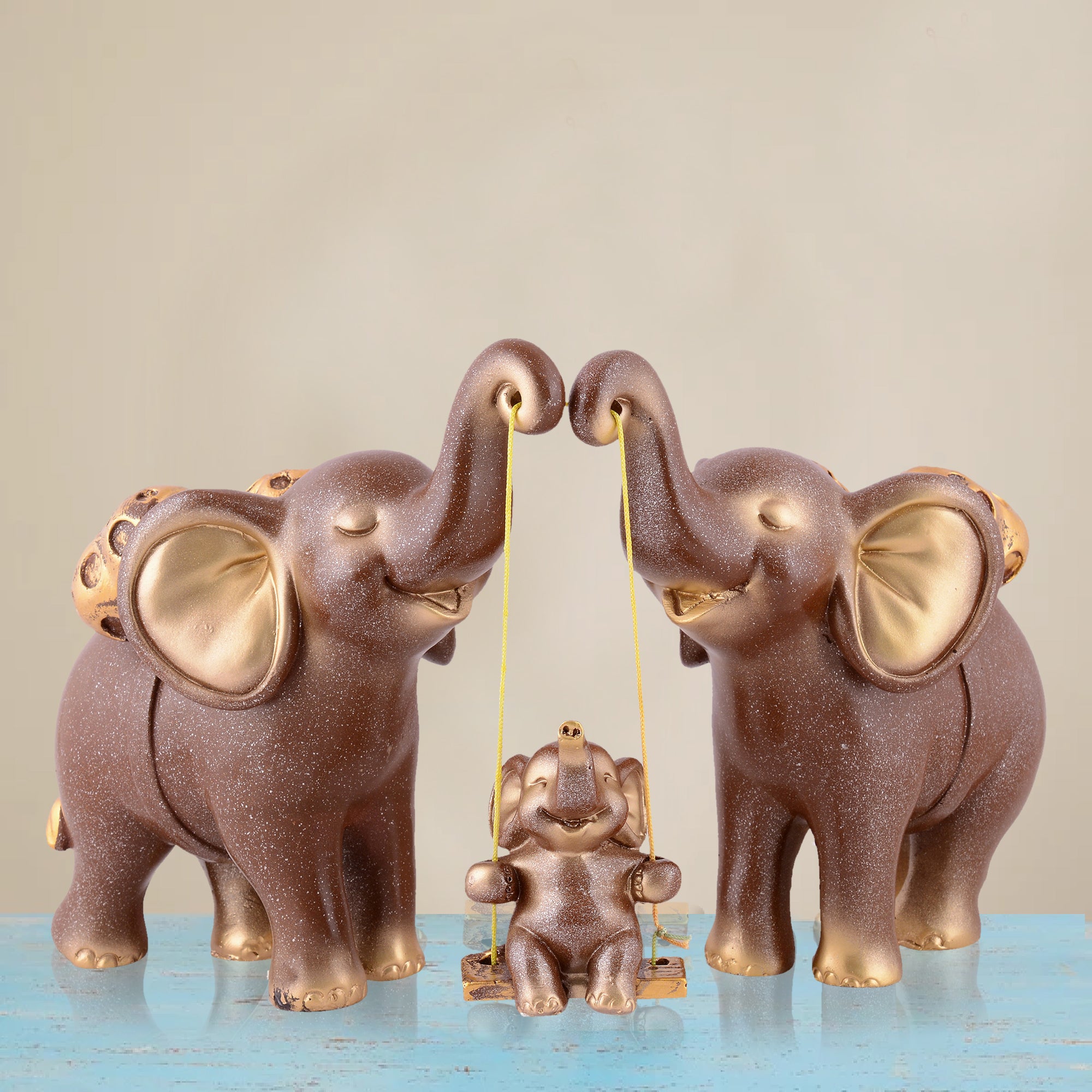 Elephant Family Showpiece with Baby on Swing - White