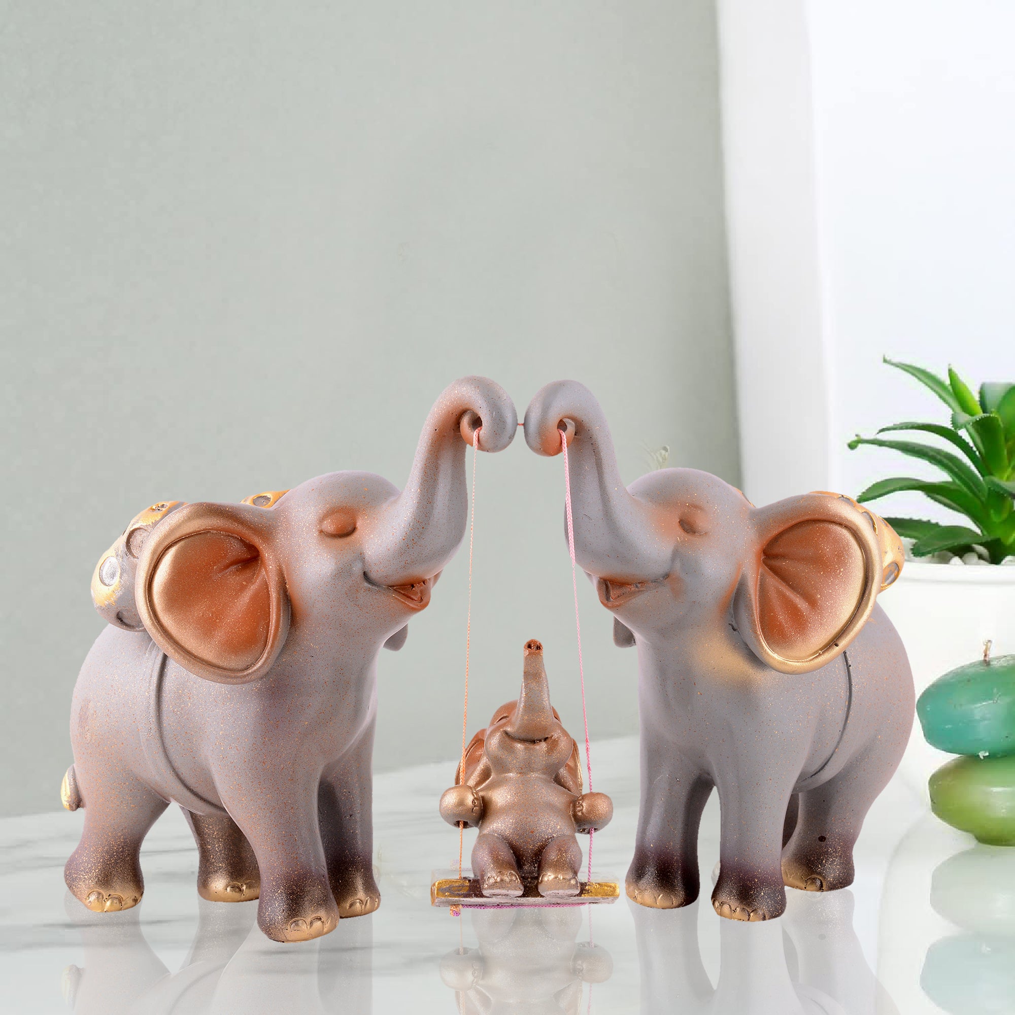 Elephant Family Showpiece with Baby on Swing - White